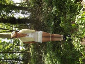 xsiteability.com - Stacey tied to a tree in the woods thumbnail