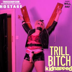 xsiteability.com - trashy goth girl  PVC mini hostage tied up gagged st Andrews cross bondage thumbnail